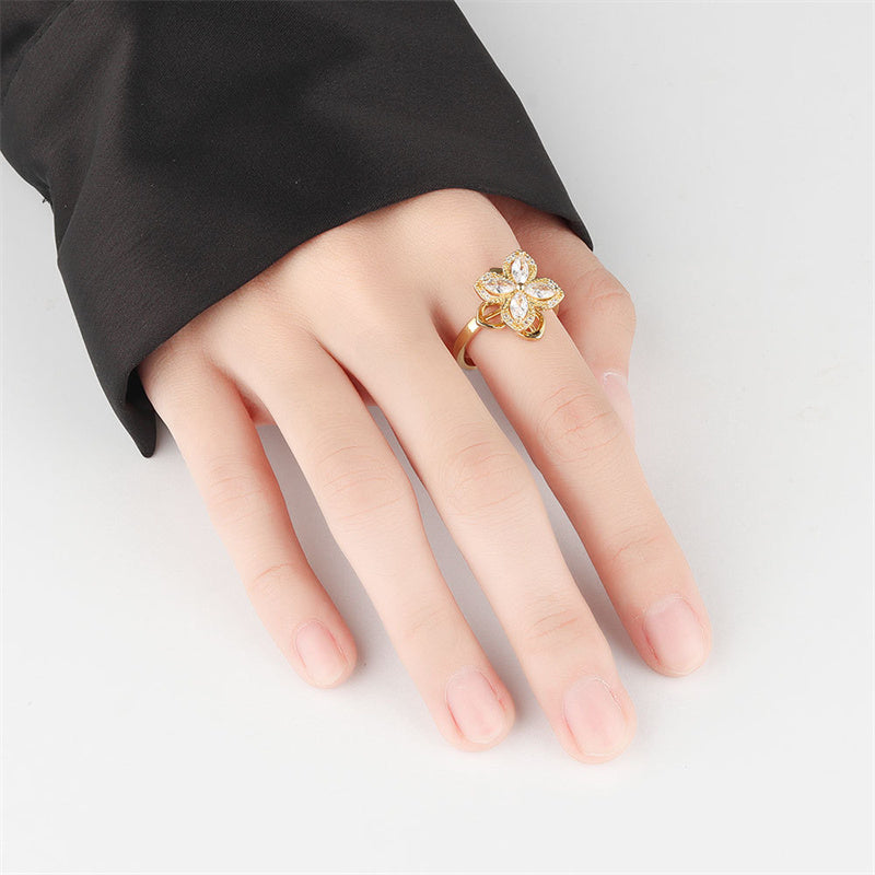 Fashionable Rotatable Four-Leaf Clover Windmill Ring with Full Zircon Inlay – A Trendsetting Statement in Personalized Jewelry!